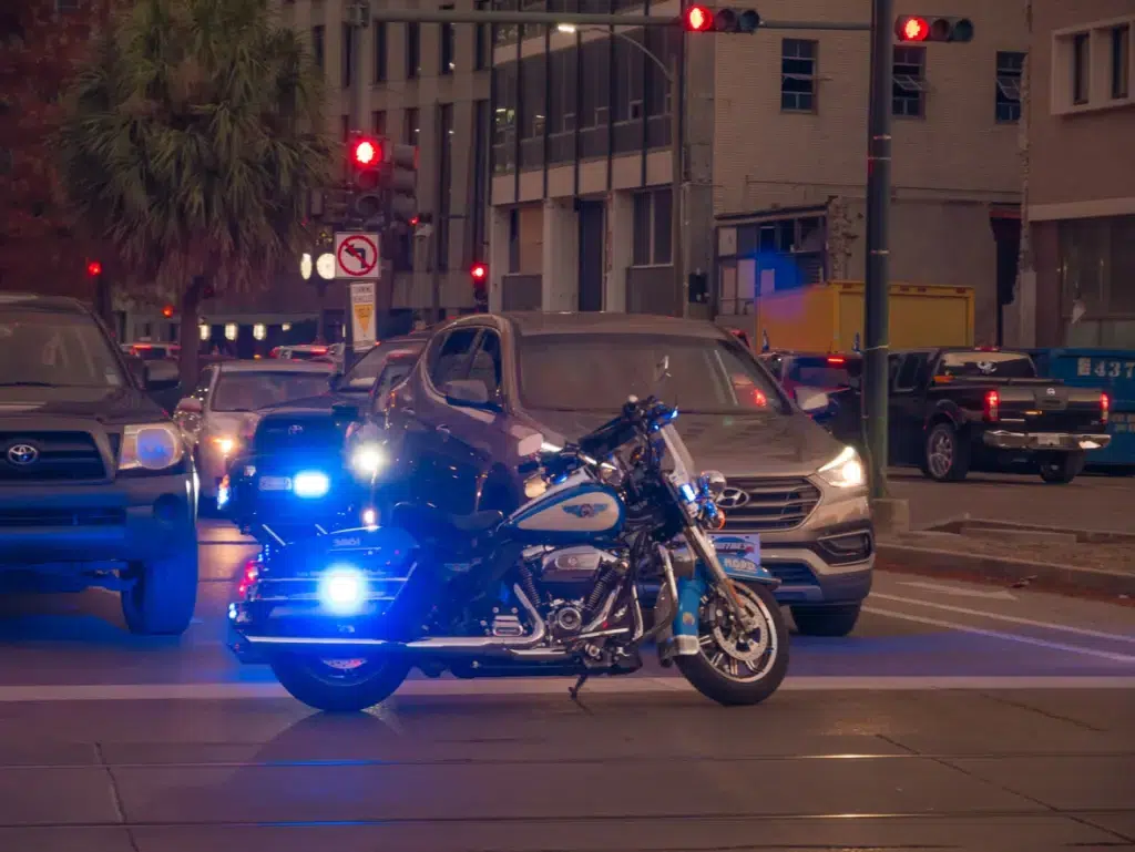 New Orleans, LA, USA. December 2019. Motorcycles, cars and police truck squad in New Orleans respond to an emergency during the sunset